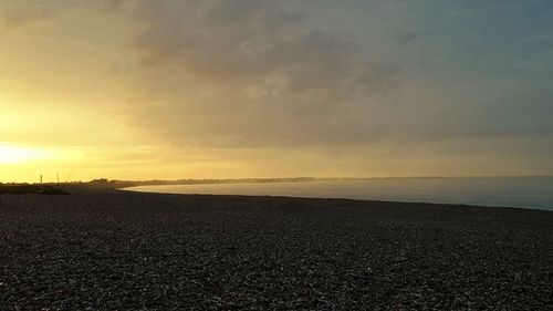 Scenic view of calm sea at sunset