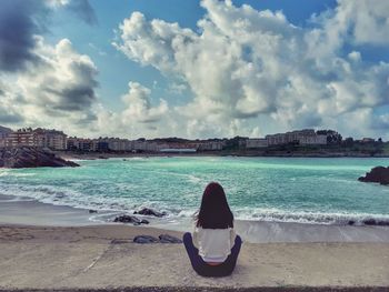 Man on beach against sky