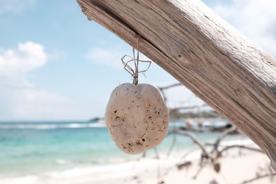 Close-up of padlock on beach