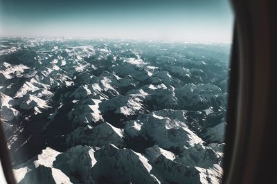 Aerial view of landscape against sky during winter