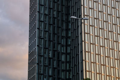 Low angle view of modern buildings against sky