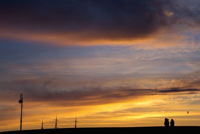 Scenic view of dramatic sky during sunset