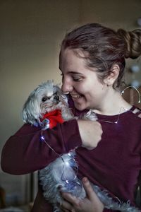 Cute girl holding dog