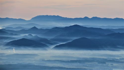 Scenic view of mountains against sky during sunset