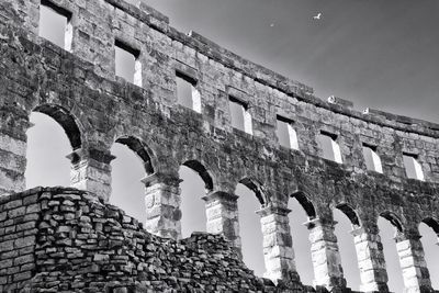 Low angle view of old ruins against sky