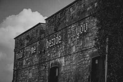 Low angle view of old building against sky