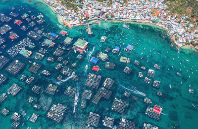 High angle view of sea and buildings in city