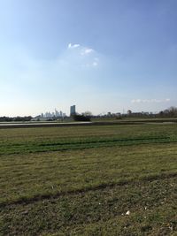 Built structure on field against blue sky