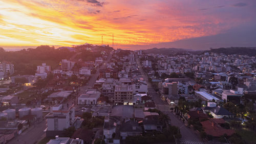 High angle view of city at sunset