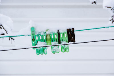 Close-up of telephone pole on snow