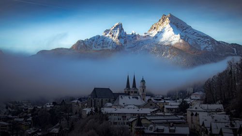 Panoramic view of townscape against sky during winter