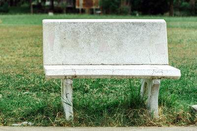 Close-up of bench in park