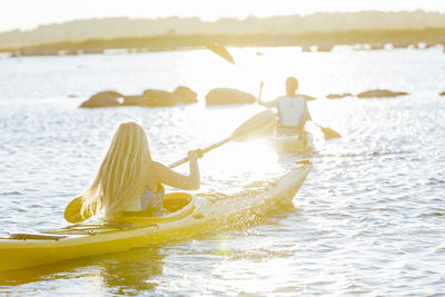 Women kayaking at evening