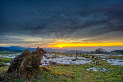 Scenic view of landscape against sky during sunset