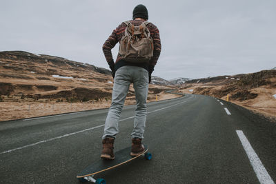 Man skateboarding on highway