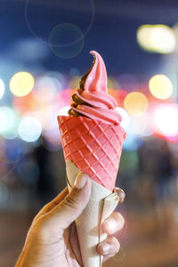 Cropped hand of woman holding ice cream cone