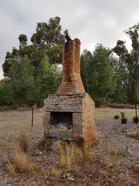 Old ruin on field against sky