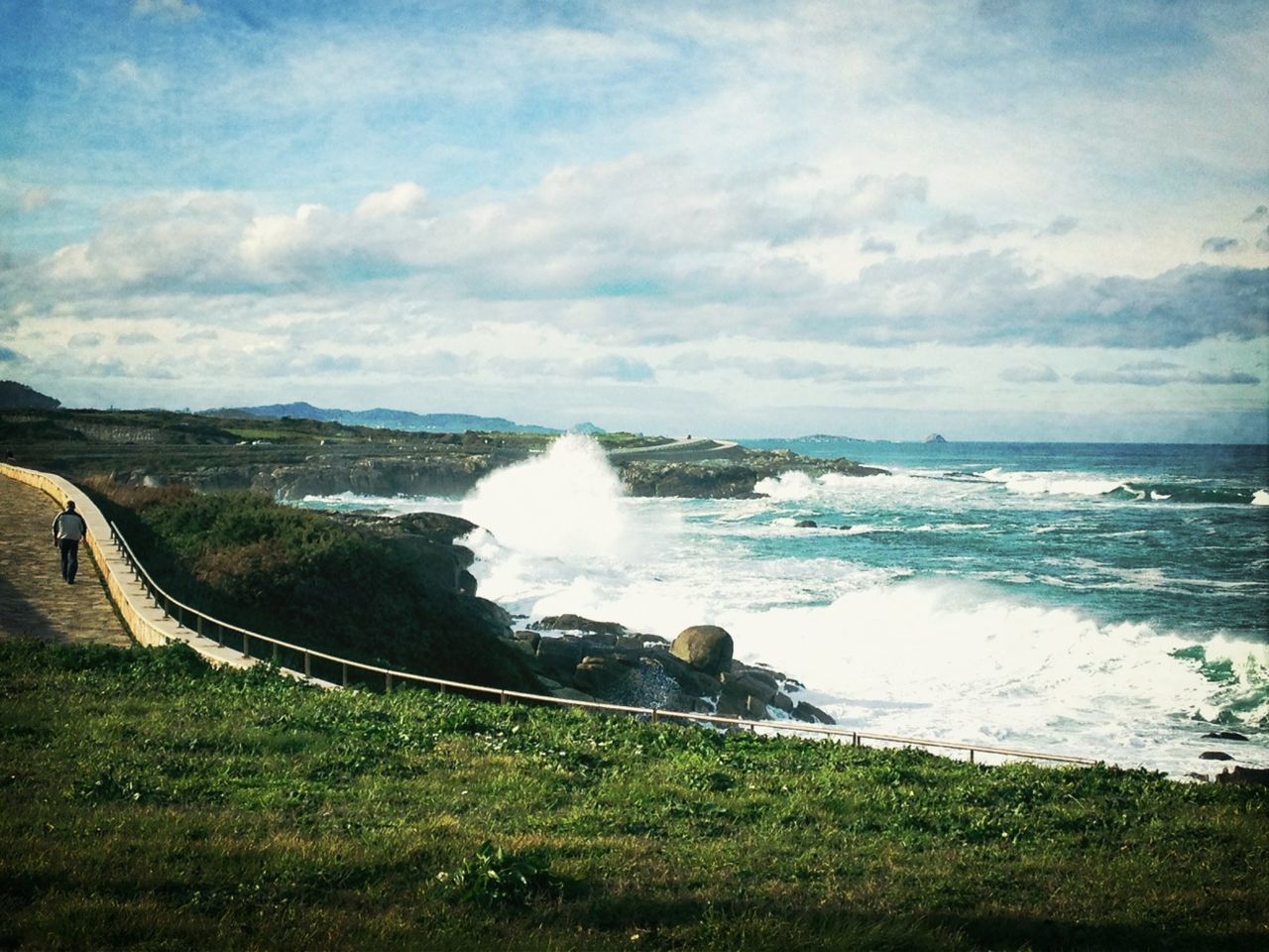 water, sky, scenics, beauty in nature, motion, sea, cloud - sky, nature, grass, surf, tranquil scene, splashing, tranquility, idyllic, horizon over water, wave, rock - object, cloud, shore, cloudy