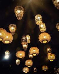 Low angle view of illuminated lights hanging from ceiling