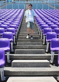 Full length of man walking on staircase