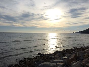Scenic view of sea against sky at sunset