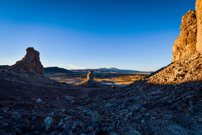 Desert view to distant mountains at dusk from the trona pinnacles rock formations in california usa