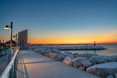 Scenic view of sea against clear sky during sunset