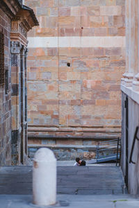 Man walking on staircase of building