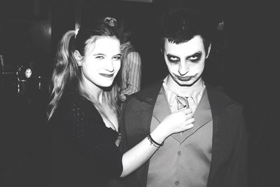 Portrait of beautiful young woman at night