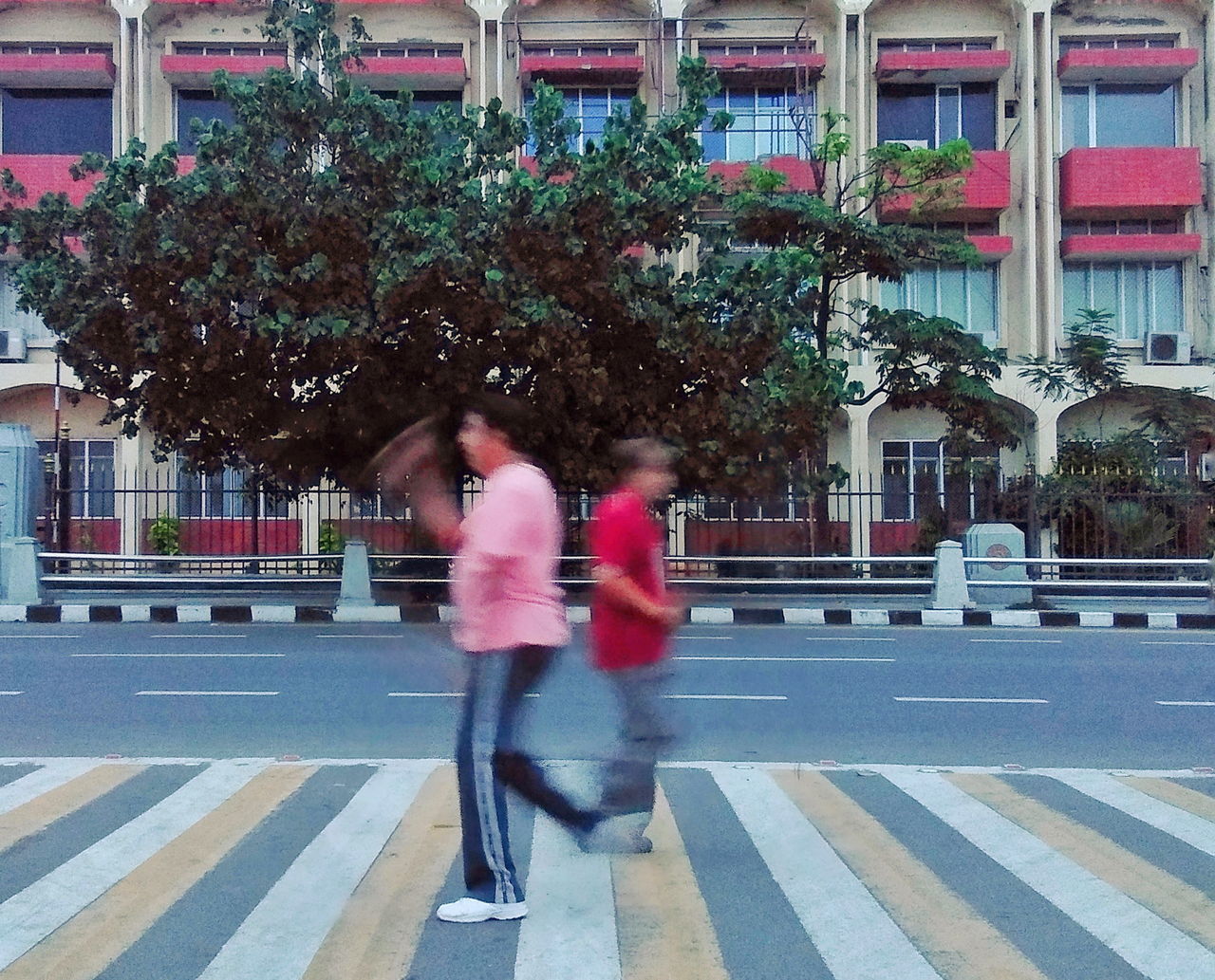 FULL LENGTH OF WOMAN WALKING ON STREET