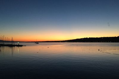 Scenic view of sea against clear sky during sunset