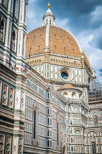 Low angle view of ornate building against sky