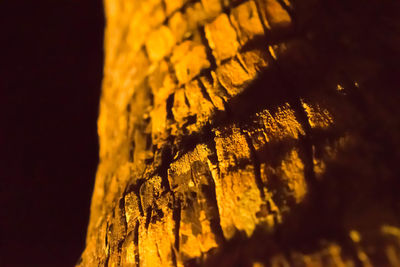 Close-up of yellow wall against sky