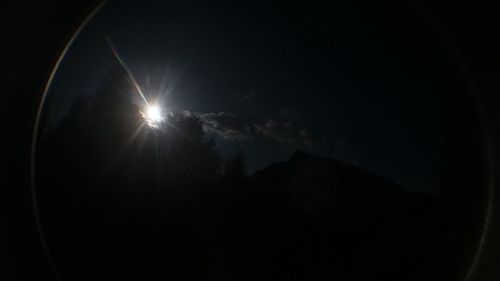 Scenic view of silhouette moon against sky at night