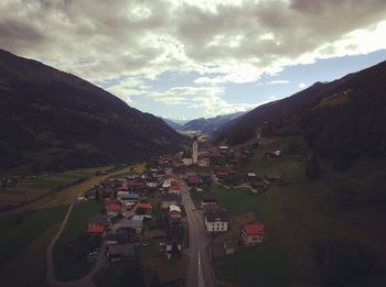 View of mountain road against cloudy sky