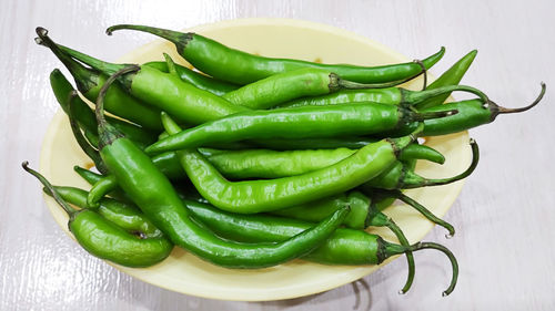 High angle view of green chili pepper on table