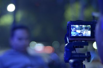Close-up of digital camera at night