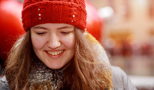 Close-up of smiling girl during winter