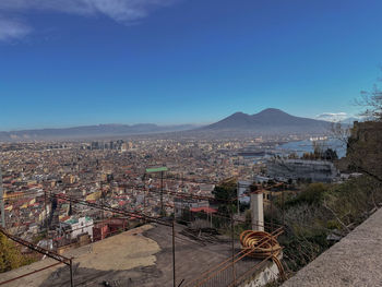 High angle view of naples townscape and vesuvio against sky