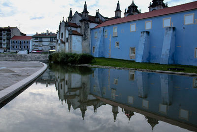 View of canal with buildings in background