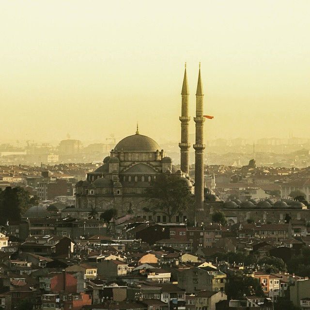 building exterior, architecture, built structure, city, cityscape, dome, church, place of worship, religion, tower, crowded, clear sky, spirituality, famous place, high angle view, travel destinations, residential district, capital cities, cathedral