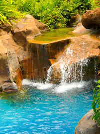 View of waterfall in swimming pool