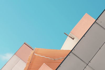 Low angle view of building against clear blue sky