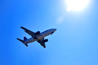 Low angle view of airplane flying in sky