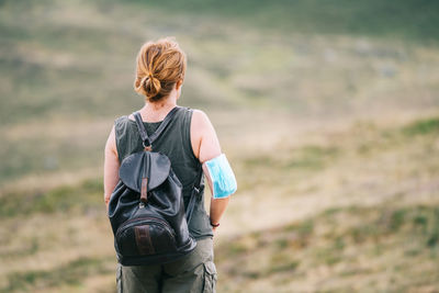 Back traveler woman with medical face mask