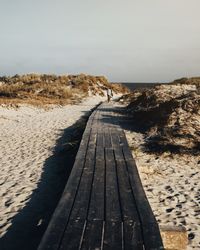 Scenic view of beach against clear sky