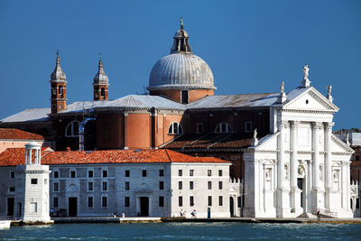 San giorgio maggiore by grand canal against clear blue sky