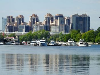 View of city by sea against sky