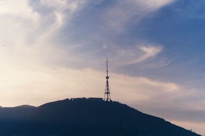 Low angle view of silhouette mountain against sky