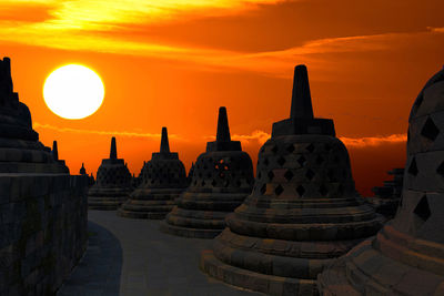 Ancient temple against sky during sunset